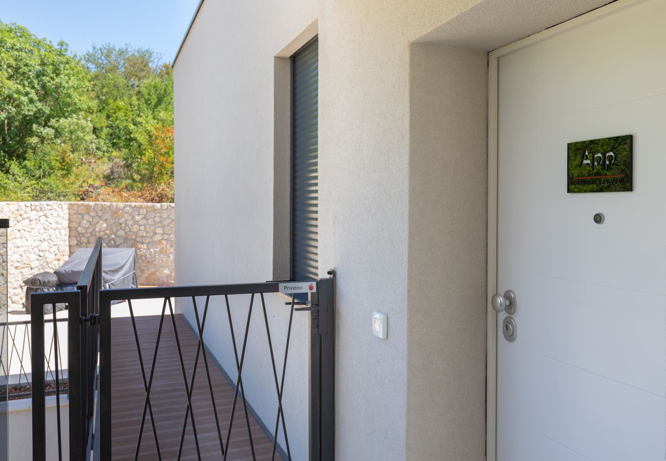 Apartment entrance with private access to the pool area.